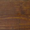 Close-up of a dark wooden surface with natural grain patterns.